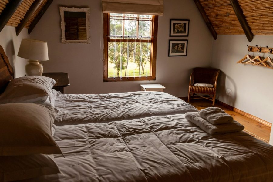 a bedroom with a bed and a chair